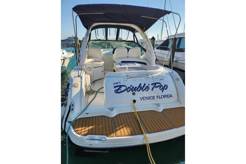 Slide: The Image of 2005 Sea Ray 340 Sundancer boat docked, named "Double Pop," Venice, Florida. - 4