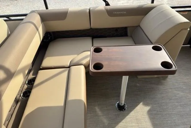Slide: The Image of Luxurious Veranda VR235F2 2026 boat interior with beige seating and wooden table. - 6