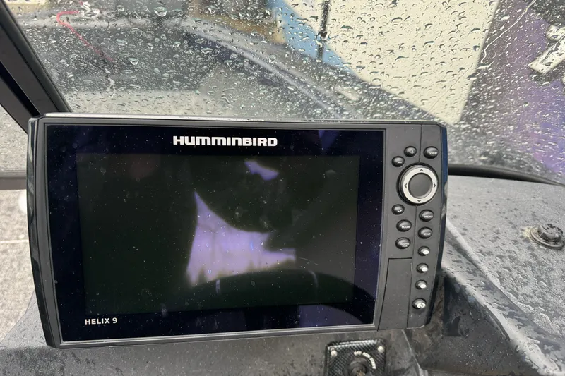 Slide: The Image of Humminbird Helix 9 fish finder on 2025 Tracker Targa V-19 WT, with raindrops on screen. - 10