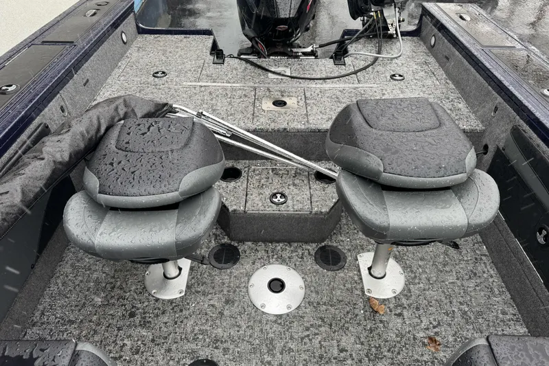 Slide: The Image of 2025 Tracker Targa V-19 WT boat interior with wet seats and carpeted flooring. - 12