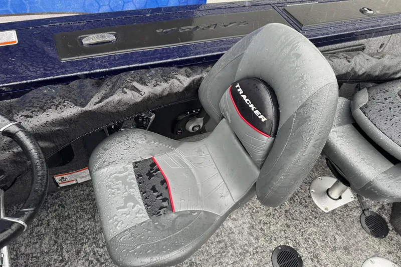 Slide: The Image of 2025 Tracker Targa V-19 WT boat interior with wet seats and steering wheel. - 13