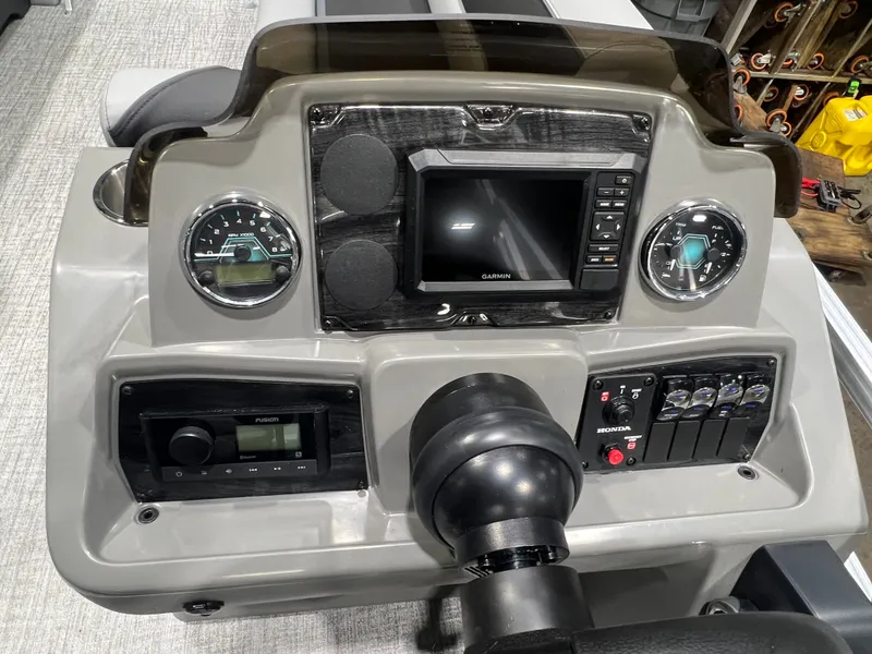 Slide: The Image of Dashboard of Tahoe Sport 1985 with Garmin navigation and Honda controls. - 11