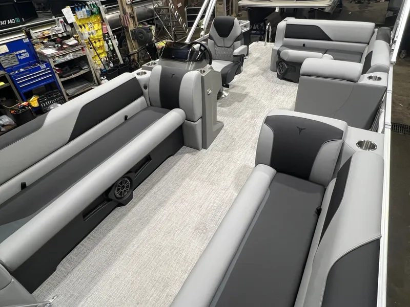Slide: The Image of Interior of 2026 Tahoe Sport 1985 Cruise boat with gray seating. - 23
