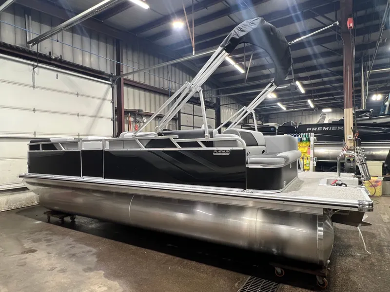 Slide: The Image of 2026 Tahoe Sport 1985 Cruise pontoon boat in warehouse. - 32