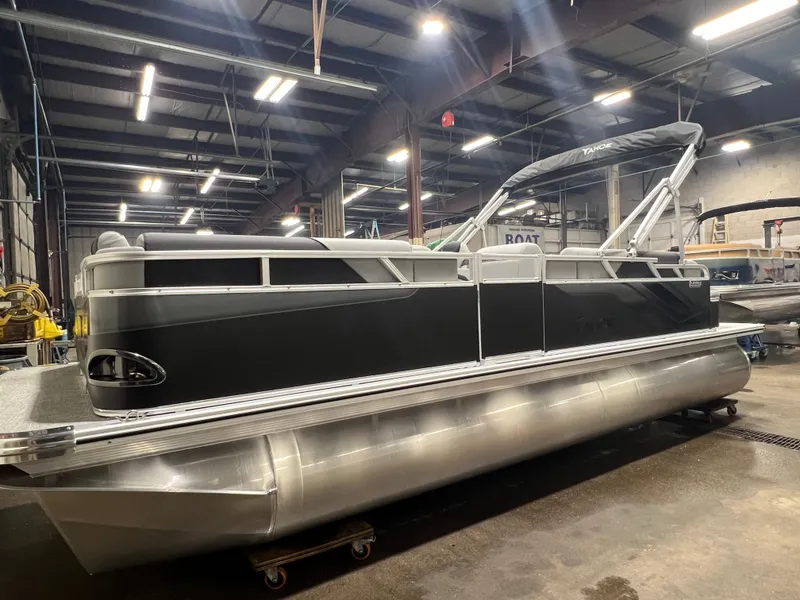 Slide: The Image of 2026 Tahoe Sport 1985 Cruise pontoon boat in warehouse. - 33