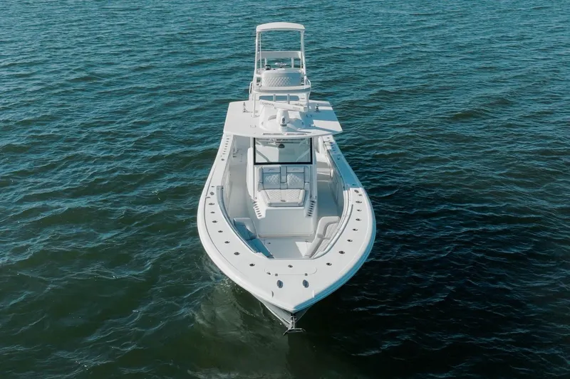 Slide: The Image of 2023 Yellowfin 42 Offshore boat on open water, aerial view. - 15