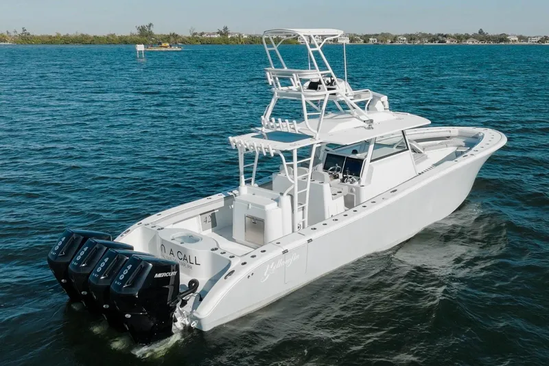 Slide: The Image of 2023 Yellowfin 42 Offshore boat with triple Mercury engines on open water. - 17