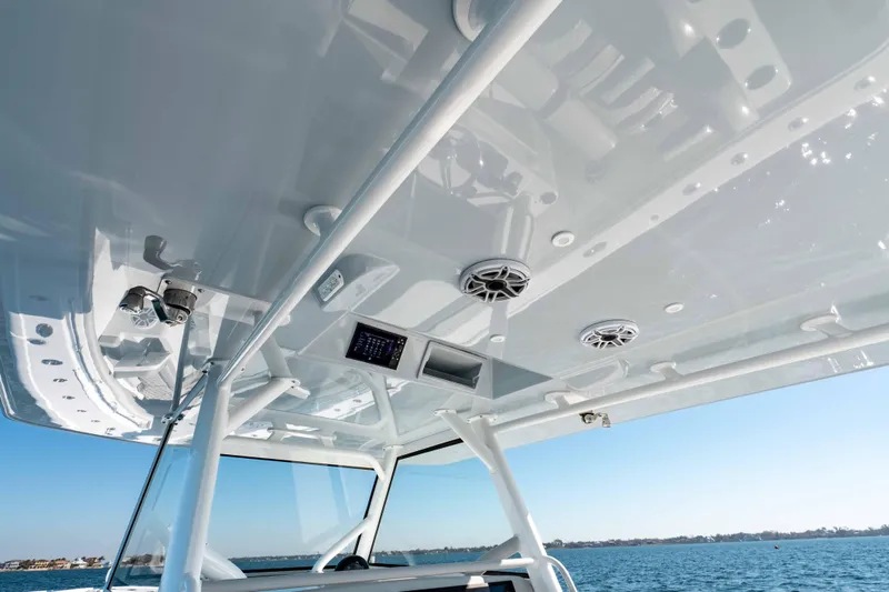 Slide: The Image of 2023 Yellowfin 42 Offshore boat interior with speakers and control panel, ocean view. - 28