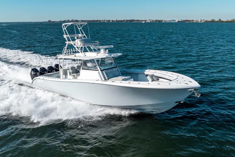 Slide: The Image of 2023 Yellowfin 42 Offshore boat cruising on open water, showcasing sleek design and powerful engines. - 3