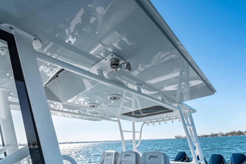 Slide: The Image of 2023 Yellowfin 42 Offshore boat, featuring sleek design and advanced technology on open water. - 31