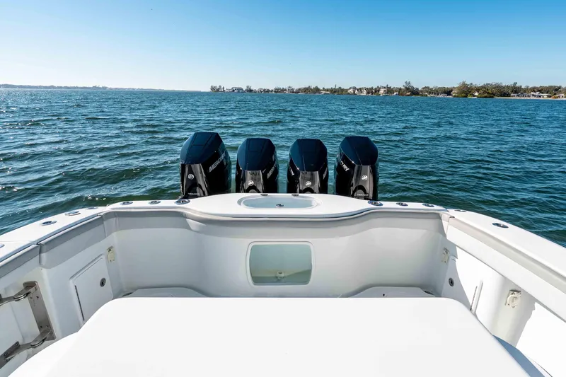 Slide: The Image of 2023 Yellowfin 42 Offshore boat with four powerful outboard engines on open water. - 34