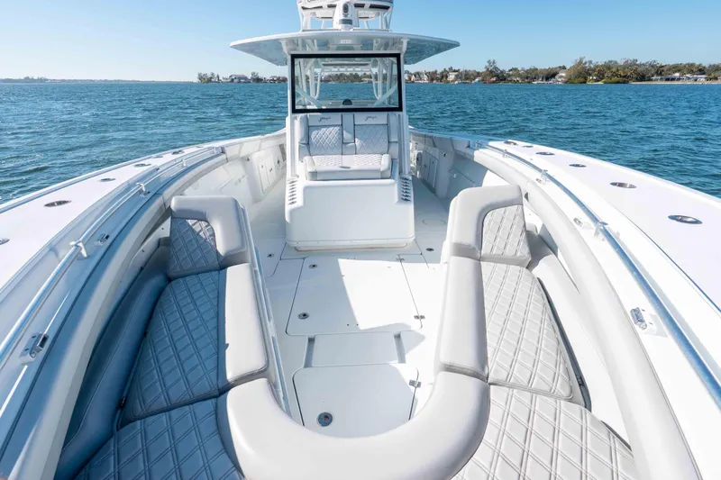 Slide: The Image of 2023 Yellowfin 42 Offshore boat with spacious seating on open water. - 37