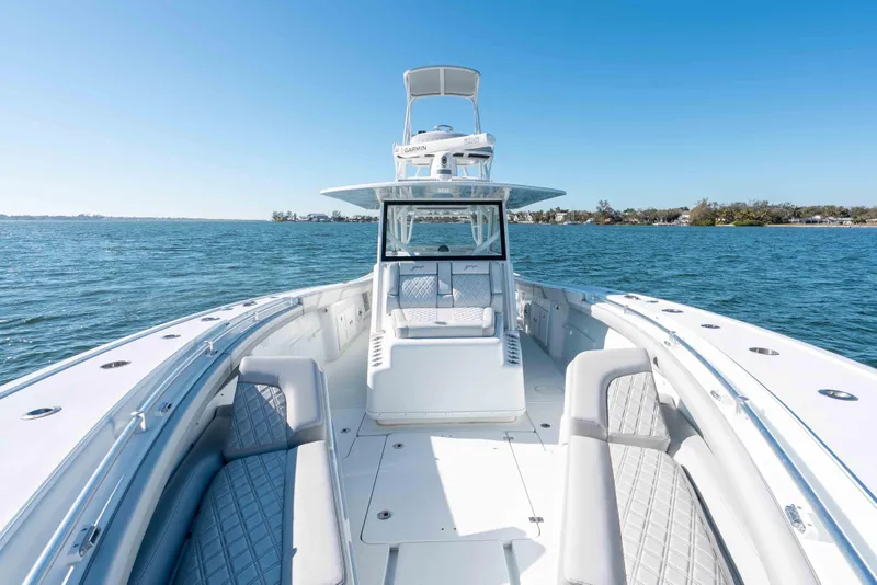 Slide: The Image of 2023 Yellowfin 42 Offshore boat on open water, showcasing sleek design and spacious deck. - 38