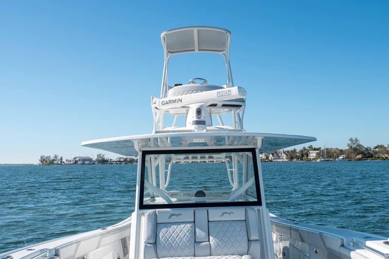 Slide: The Image of 2023 Yellowfin 42 Offshore boat on water, featuring Garmin equipment and luxurious seating. - 39