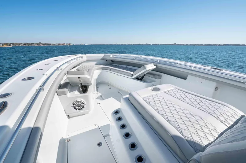 Slide: The Image of 2023 Yellowfin 42 Offshore boat interior with luxurious seating on open water. - 40