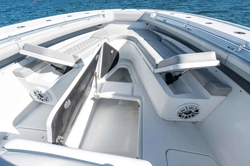 Slide: The Image of 2023 Yellowfin 42 Offshore boat interior with seating and storage compartments. - 41