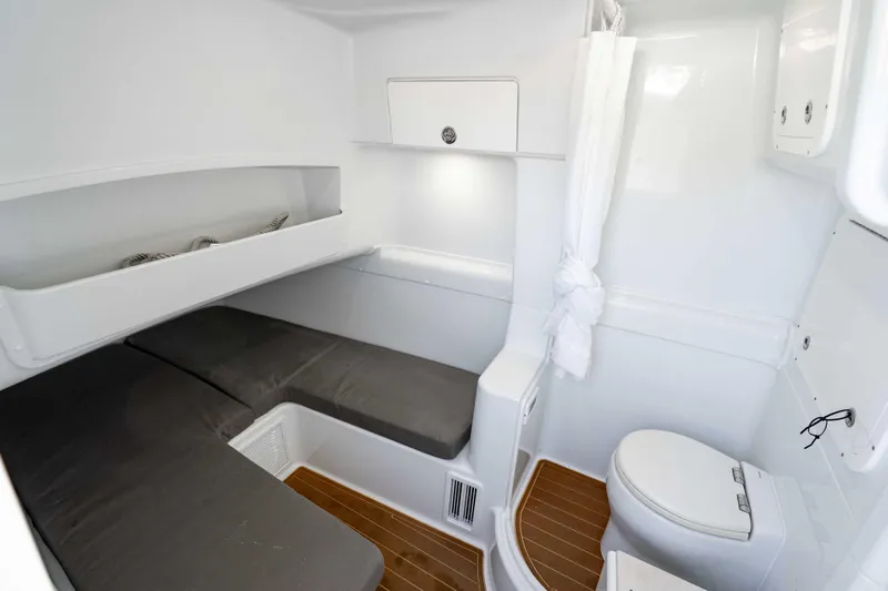 Slide: The Image of 2023 Yellowfin 42 Offshore cabin interior with bed and toilet. - 50