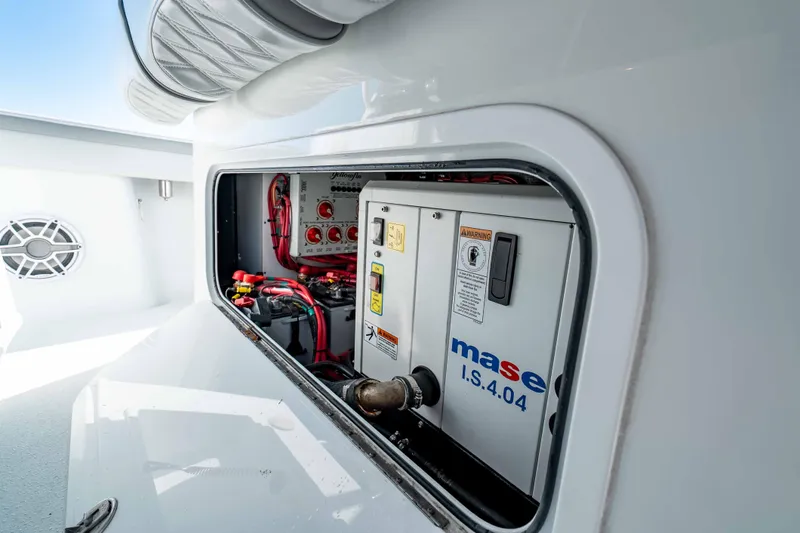 Slide: The Image of 2023 Yellowfin 42 Offshore boat engine compartment with Mase generator and wiring. - 56