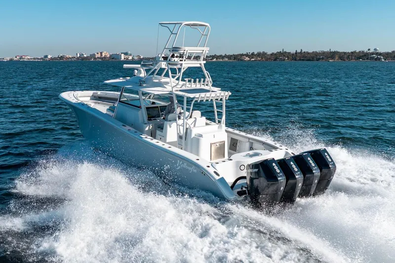 Slide: The Image of 2023 Yellowfin 42 Offshore boat cruising on open water with powerful engines. - 8