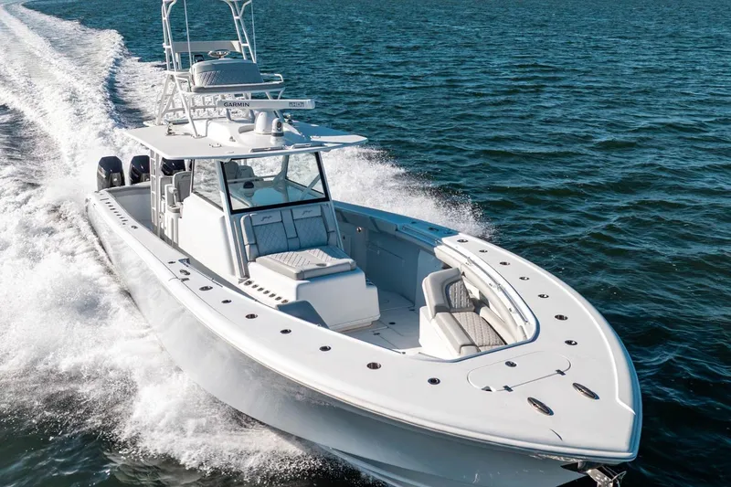 Slide: The Image of 2023 Yellowfin 42 Offshore boat cruising on open water, showcasing sleek design and powerful performance. - 9