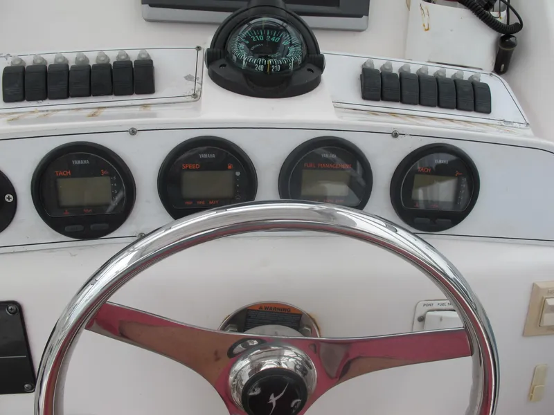 Slide: The Image of Dashboard of a 2004 Pro-Line 30 Walkaround boat. - 13