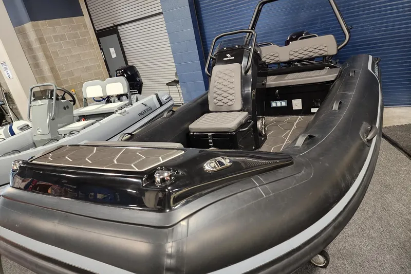Slide: The Image of 2026 Highfield Sport 420 inflatable boat with sleek black design and modern seating. - 3