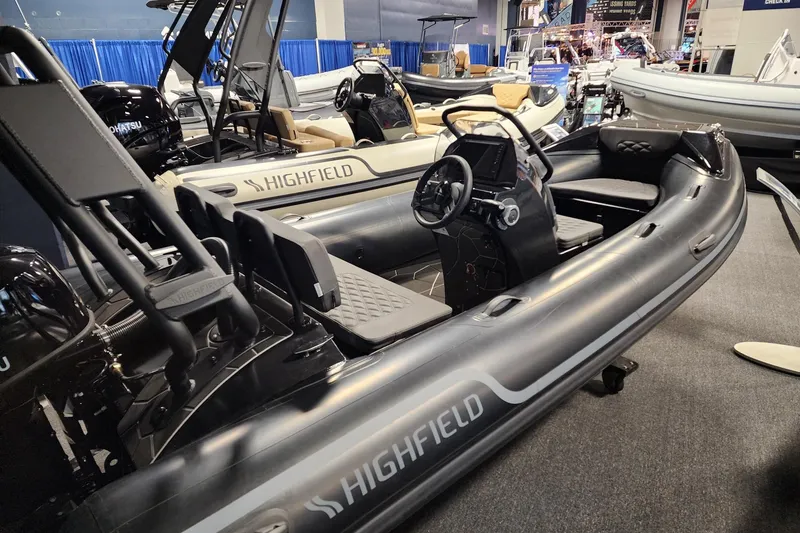 Slide: The Image of 2026 Highfield Sport 420 inflatable boat displayed at a marine exhibition. - 9