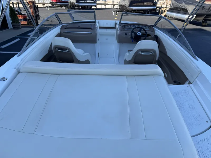 Slide: The Image of Interior of a 2008 Cobalt 202 boat with white seating. - 11