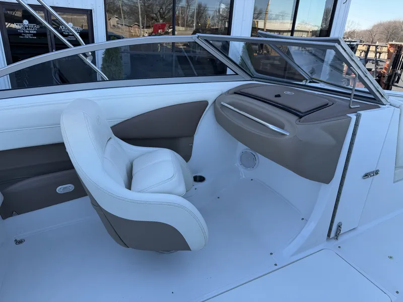 Slide: The Image of Interior of a 2008 Cobalt 202 boat with beige and white seating. - 17