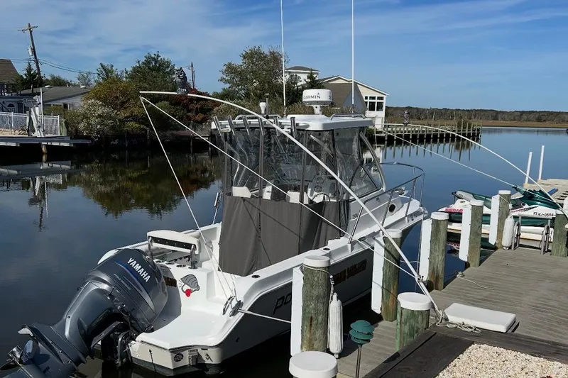The Image of 2007 Polar 2300 Walkaround boat docked with Yamaha outboard motor. - 0