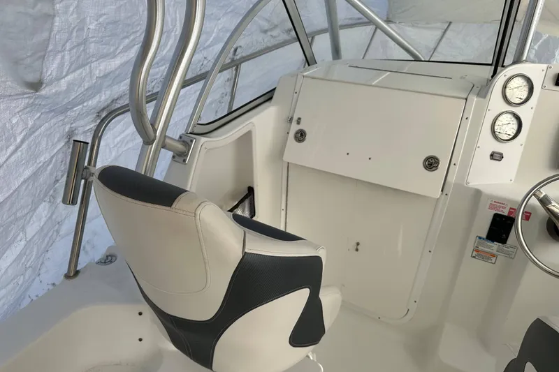 Slide: The Image of 2007 Polar 2300 Walkaround boat interior with steering wheel and gauges. - 5