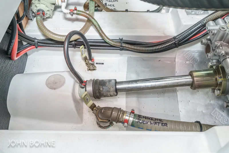 Slide: The Image of Engine compartment of 2018 Beneteau Swift Trawler 44 with visible hoses and components. - 102