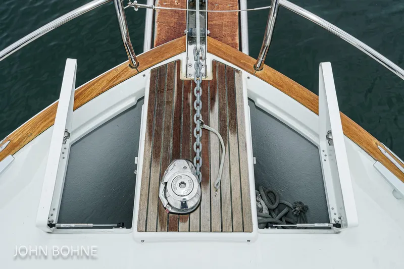 Slide: The Image of Bow of 2018 Beneteau Swift Trawler 44 with anchor chain and wooden deck. - 16