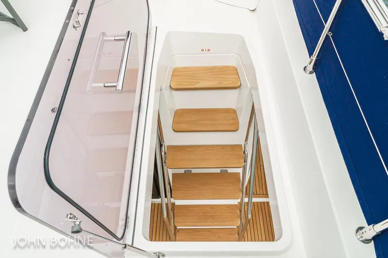 Slide: The Image of Staircase on 2018 Beneteau Swift Trawler 44, featuring wooden steps and sleek design. - 35