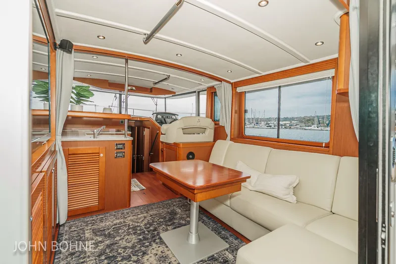 Slide: The Image of Luxurious interior of 2018 Beneteau Swift Trawler 44 with elegant seating and panoramic windows. - 47