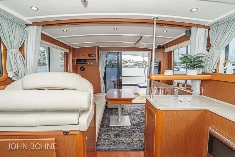 Slide: The Image of Interior of 2018 Beneteau Swift Trawler 44, featuring elegant wood finishes and modern amenities. - 57