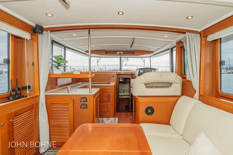 Slide: The Image of Interior of 2018 Beneteau Swift Trawler 44 with wood finish and modern amenities. - 58