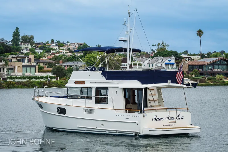 Slide: The Image of 2018 Beneteau Swift Trawler 44 on water near coastal homes, Newport Beach. - 6