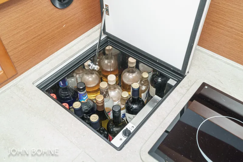 Slide: The Image of Hidden liquor storage on 2018 Beneteau Swift Trawler 44 yacht. - 64