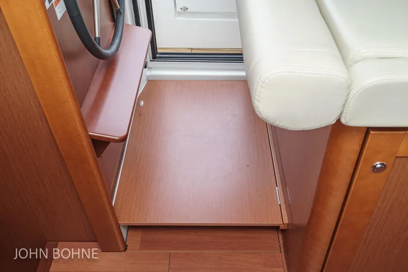Slide: The Image of Interior of 2018 Beneteau Swift Trawler 44, featuring wooden flooring and seating. - 78