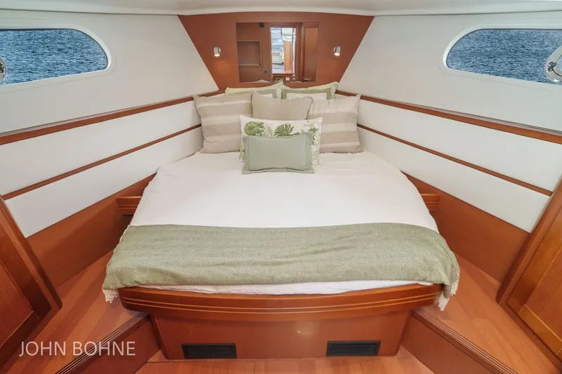 Slide: The Image of Luxurious cabin interior of 2018 Beneteau Swift Trawler 44 with elegant bedding. - 81