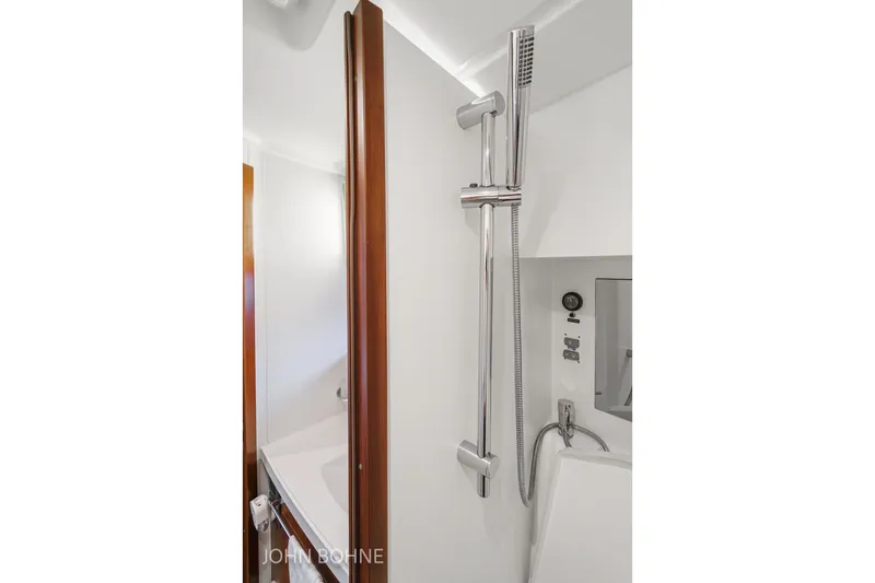 Slide: The Image of Bathroom interior of 2018 Beneteau Swift Trawler 44 with modern shower fixtures. - 86