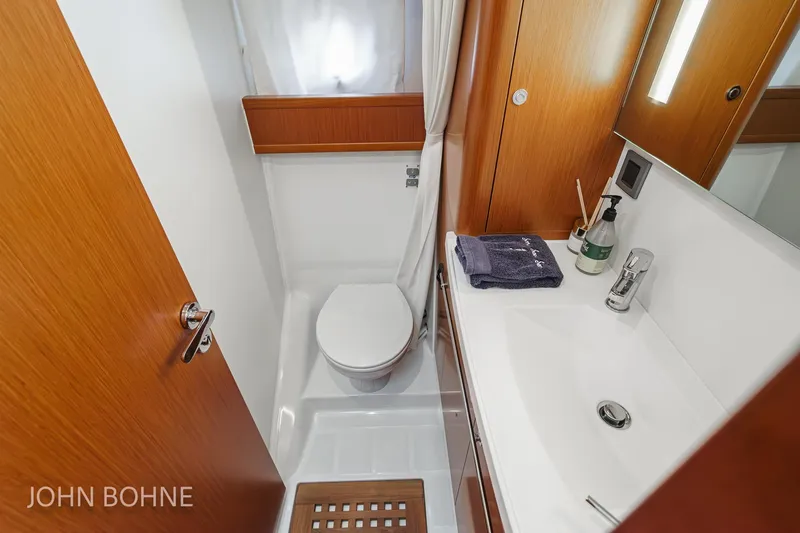 Slide: The Image of 2018 Beneteau Swift Trawler 44 bathroom with modern fixtures and wooden accents. - 89