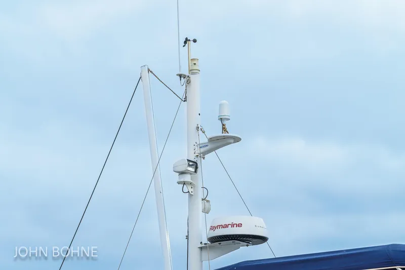 Slide: The Image of Radar and antenna on 2018 Beneteau Swift Trawler 44 against cloudy sky. - 90