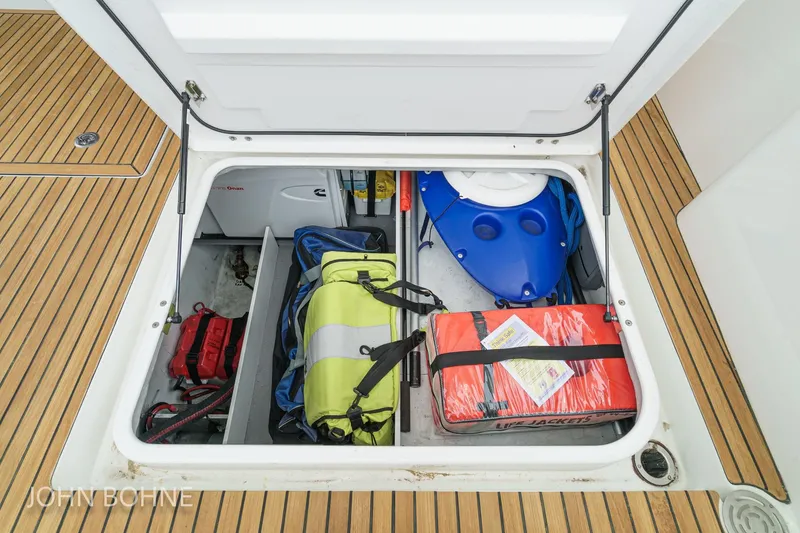 Slide: The Image of Storage compartment on 2018 Beneteau Swift Trawler 44 with safety gear and equipment. - 92
