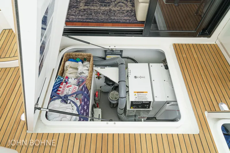 Slide: The Image of Engine compartment of 2018 Beneteau Swift Trawler 44 with Cummins Onan generator. - 93