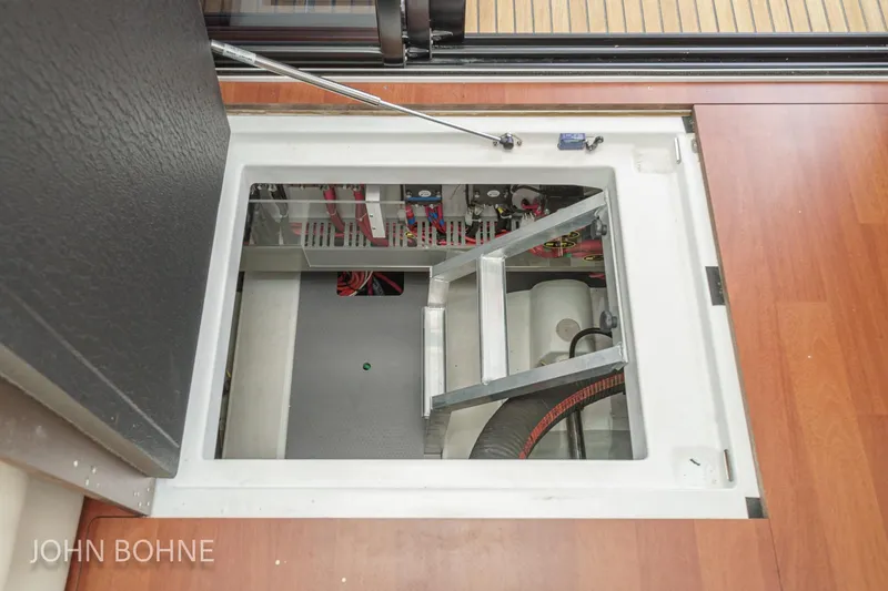 Slide: The Image of Engine compartment of 2018 Beneteau Swift Trawler 44, showcasing interior access and components. - 96