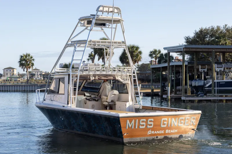 Slide: The Image of Island Hopper 30 boat "Miss Ginger" docked at Orange Beach marina, 2000 model. - 10