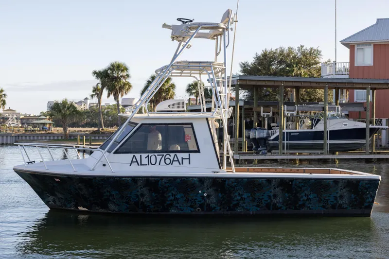 Slide: The Image of Island Hopper 30 boat "Miss Ginger" on water near Orange Beach marina, 2000 model. - 11