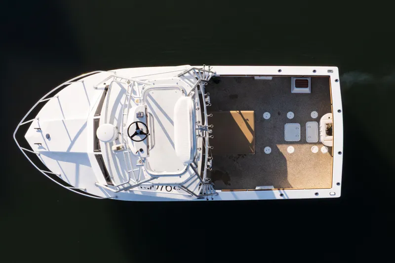 Slide: The Image of Top view of a 2000 Island Hopper 30 boat on calm water. - 16